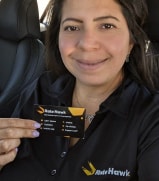 Ratehawk employee with business card.